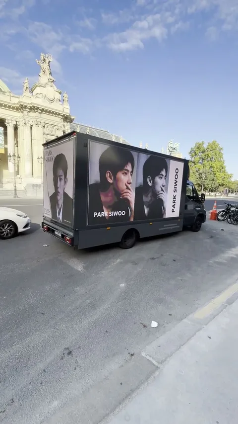 Park Siwoo fan-support artwork on the LED truck in front of the Grand Palais in Paris.